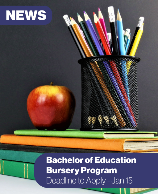 cup of pens and pencils sitting on a stack of books with an apple