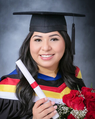 woman in grad cap smiling for the camera