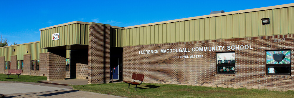 school entrance brick building with green roof