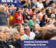 crowd of people listening to a speaker