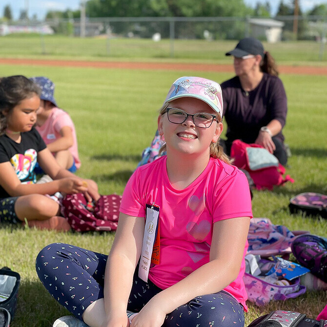 students eating lunch on the grass