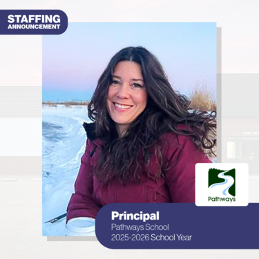woman smiling for the camera in an outdoor winter setting