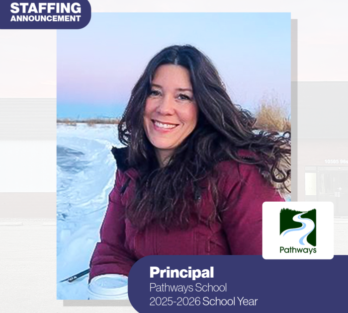 woman smiling for the camera in an outdoor winter setting